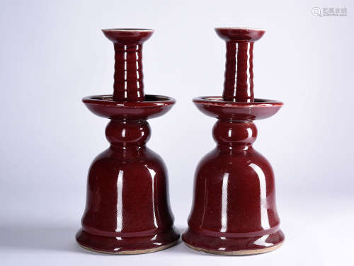 A PAIR OF RED-GLAZED CANDLESTICKS, 18-19TH CENTURY