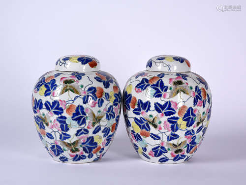A PAIR OF FAMILLE ROSE JARS AND COVERS, 18TH CENTURY
