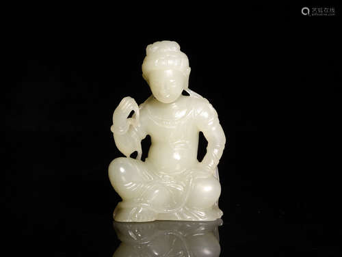 A CARVED WHITE JADE FIGURE, 18-19TH CENTURY