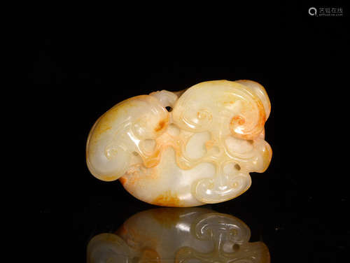 A CREAMY WHITE AND RUSSET JADE ORNAMENT, 18TH CENTURY