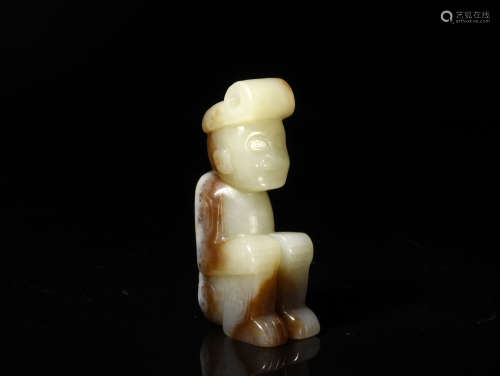 A WHITE AND RUSSET JADE FIGURE