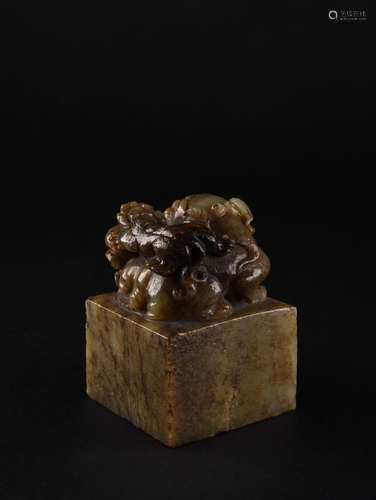 A CELADON AND RUSSET JADE SEAL, 18TH CENTURY