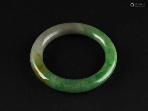 A JADEITE BANGLE, 19TH CENTURY