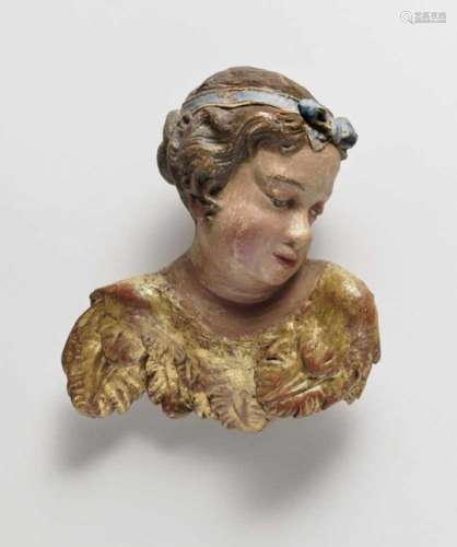 A Cherub HeadSouth German, mid-18th Century Limewood, reverse flattened. Retouched polychrome