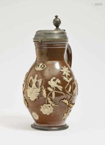 A Pear-Shaped JugBunzlau, 18th Century Stoneware with clay glaze and relief overlay. Pewter cover