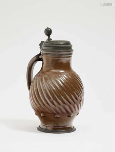 A JugBunzlau, 18th Century Stoneware with brown clay glaze. Pewter cover and base, monogrammed A.E.