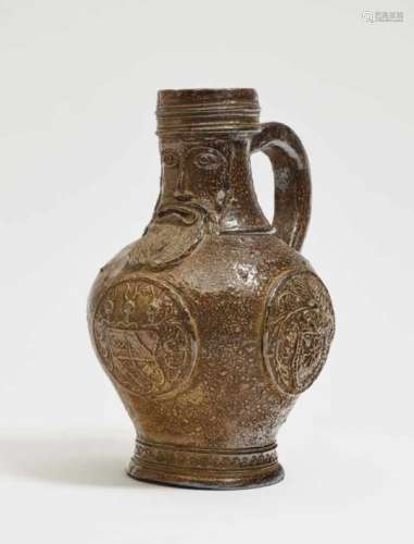 A Bellarmine jugFrechen, 17th Century Stoneware. Speckled salt glaze. Handle damaged. Height 24.5