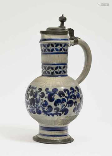 A Narrow-Necked JugWesterwald, 18th/19th Century Salt-glazed stoneware. Pewter cover and base.