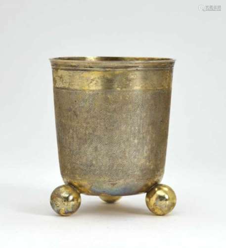 A Beaker with Ball FeetStrasbourg, late 17th Century Silver, gold-plated. Snakeskin pattern.
