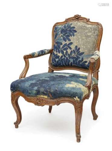 A FauteuilFrance, mid-18th Century Beechwood. Old tapestry cover. Restored, age appropriate signs of
