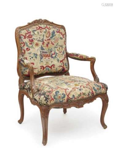 A FauteuilProbably France, mid-18th century Beech, glazed. Old embroidery cover. Restored, age