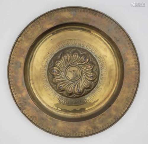 A BowlGerman, 2nd half of the 16th Century Brass. Embossed decoration. Repaired. Diameter 47 cm.