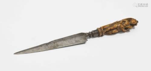 A Knife with Wooden HandleLate 17th Century Iron blade. Carved wooden handle. Length 22 cm.Religious