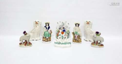 Pair 19th century Staffordshire pottery model spaniels, Staffordshire pottery group of lovers in