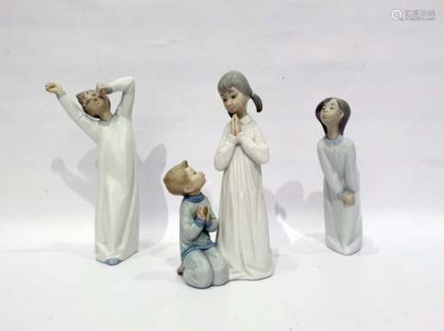Lladro group of two children saying their prayers and two other Lladro figures of children in