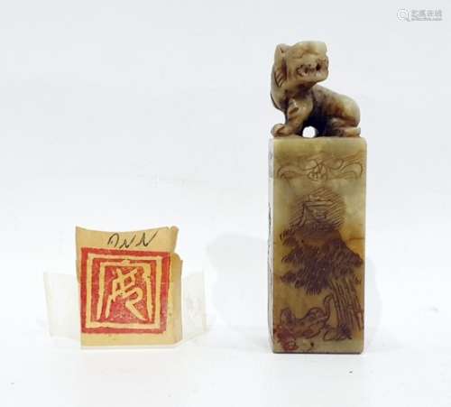 Chinese carved soapstone seal surmounted with a tiger, the square section seal engraved with