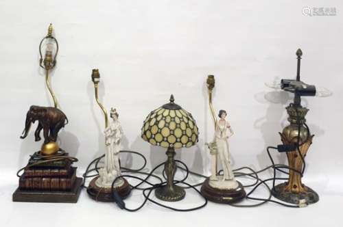 Quantity of table lamps including faux-books on a stand with a resin elephant balancing on a