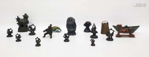 Assorted metalware to include cow bell, Chinese-type figure, Shuco 3000 wind-up car, etc