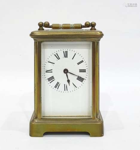 Brass carriage clock with Roman numerals to the enamel dial, 11cm high