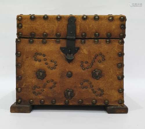 Brown leather and brass studded box opening to reveal assorted magic lantern slides of Victorian and