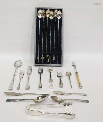 Set of six white metal Oriental cocktail spoons with various charm attachments to the handles, cased