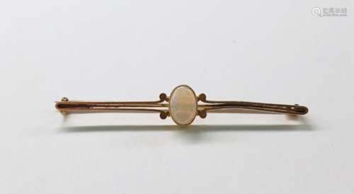 Opal set bar brooch with single oval cabochon stone, on gold-coloured metal mount