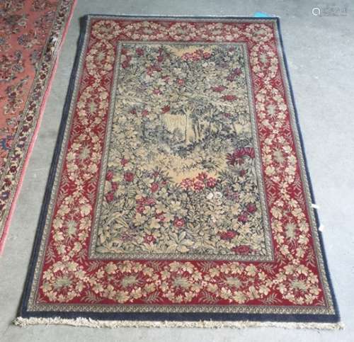Modern rug, the central field with wooded landscape scene, red ground foliate decorated border
