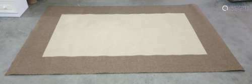 Modern cream ground rug with brown border, 303cm x 200cm