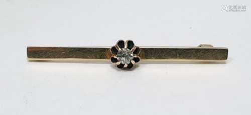 Gold-coloured metal and diamond bar brooch, the old cut diamond in raised claw setting