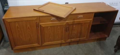 Mid twentieth century G-Plan teak sideboard with central drawer above two cupboard doors flanked