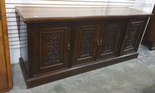 Early 20th century oak sideboard, the rectangular top with moulded edge above four panelled cupboard