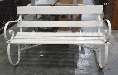 White painted garden bench with scroll iron end supports