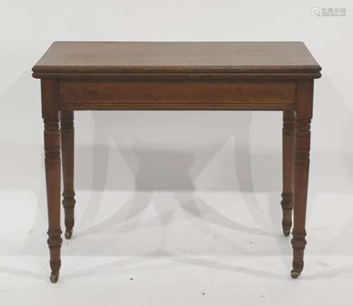 Late 19th/early 20th century folding card table on turned ring supports to brass caps and castors,