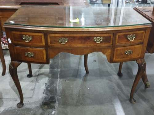 Early 20th century walnut bowfront desk with five assorted drawers, to cabriole supports, 105cm x