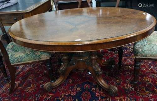 Victorian oval walnut centre table with applied moulded edge, birdcage type pedestal, to four