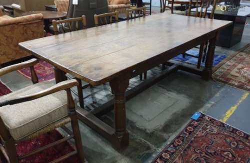 Early 20th century oak rectangular plank-top farmhouse table on turned supports, stretchered base