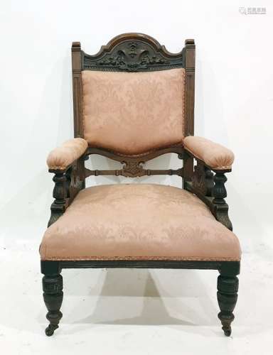 Two Victorian salon chairs, arched top rails with moulded decoration pink upholstered back and arm