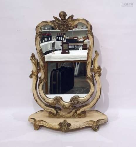 Dressing table swing mirror in the rococo taste, the whole surmounted by cherub, all painted cream