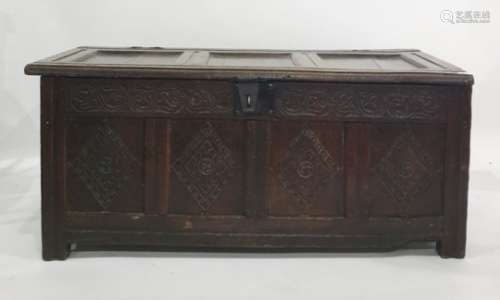 Possibly 17th century oak coffer with four diamond carved panels to the front, with iron lock and