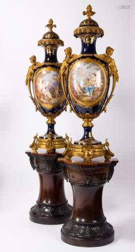 A pair of monumental vases in SËvres porcelain with gilt bronze mounts on mahogany stands, 19th