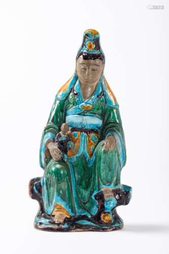 A Chinese statue in Fahua earthenware 'guanyin with child', Ming dynasty (*) (42cm)