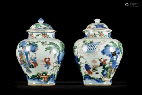 A pair of Chinese Wucai vases 'children playing', 17th century (*) (34cm)