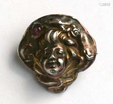An Art Nouveau silver gilt Unger Brothers brooch, 1.5cms (1ins) wide.