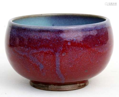 A Chinese Jun ware bowl with mottled red and blue glaze, 14cms (5.5ins) diameter.Condition Report