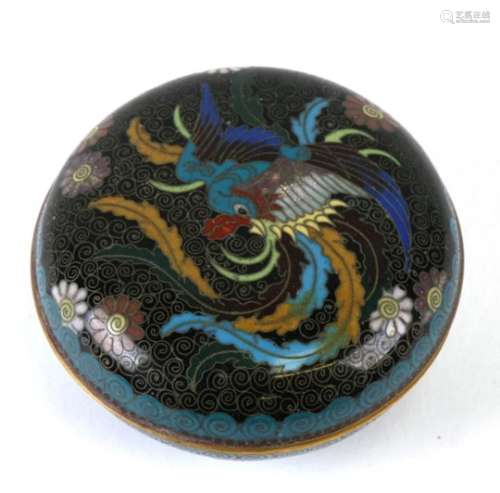 A Chinese cloisonne box and cover of compressed circular form decorated with a phoenix and flowers