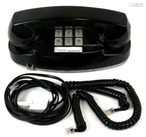 A vintage Princess black push button telephone.