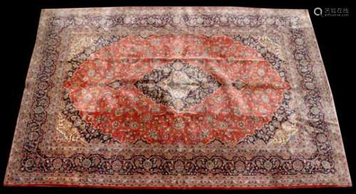 A fine Persian Kashan hand knotted woollen handmade carpet with central medallion within foliate