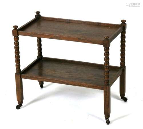 A miniature oak two-tier tea trolley on bobbin turned supports (possibly an apprentice piece)