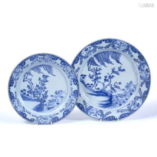 Two blue and white plates Chinese 19th Century the first decorated depicting a river with two