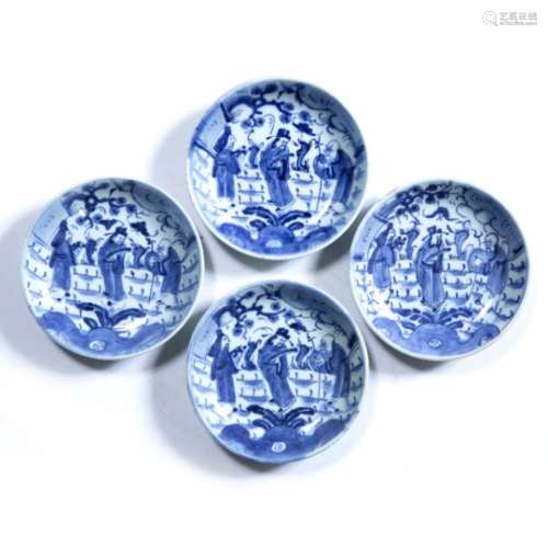 Four blue and white dishes Chinese, late Ming (1368-1644) each decorated with three Immortals with